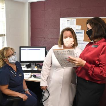 Three women work together in office