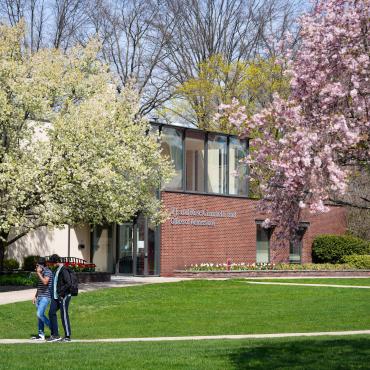 students on campus in the spring