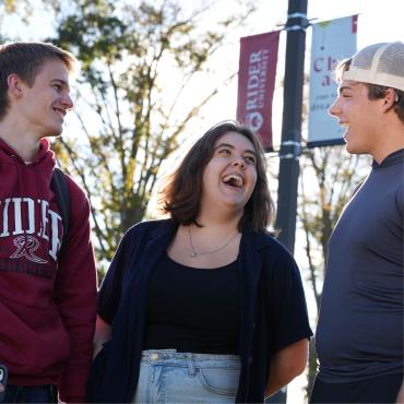 Students laughing together on Rider campus