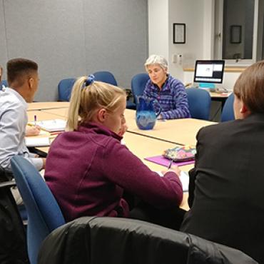 Students and faculty group discussion.
