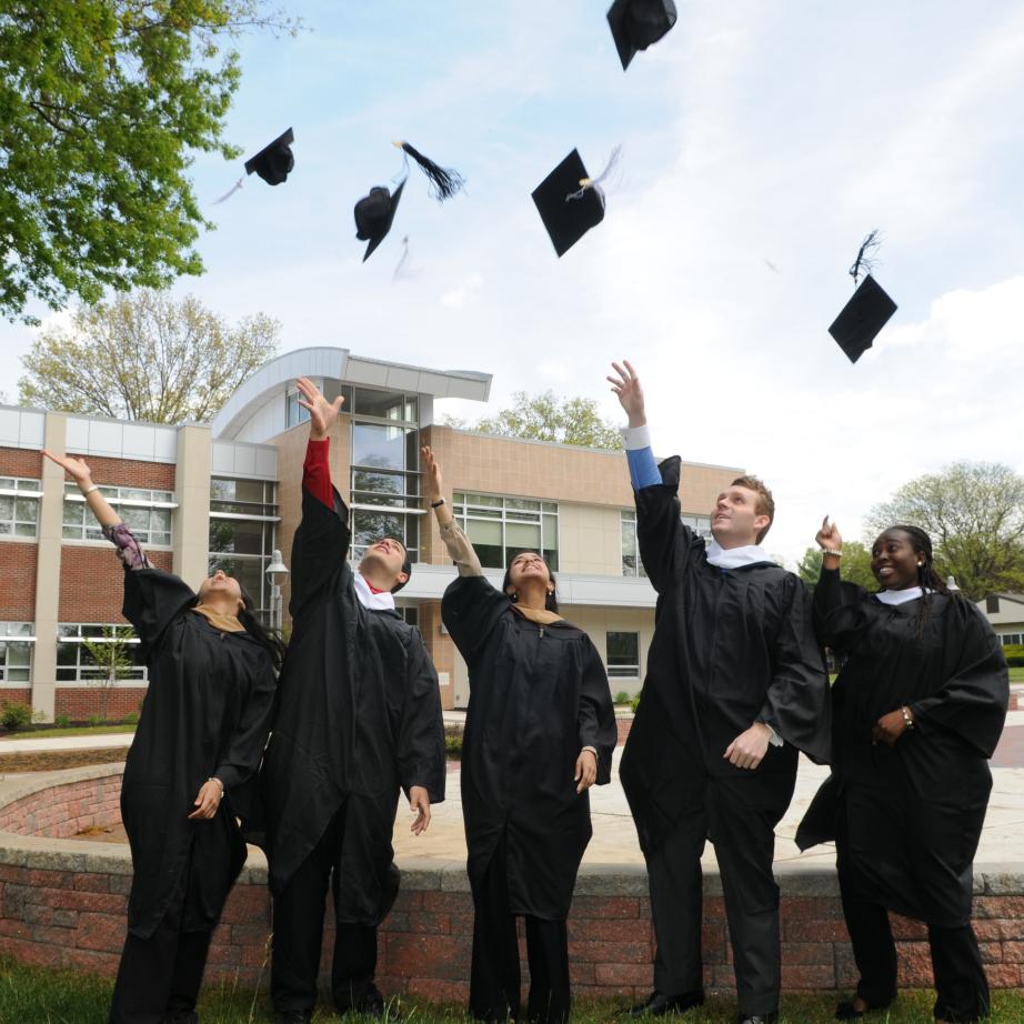 Rider graduates toss their caps at commencement