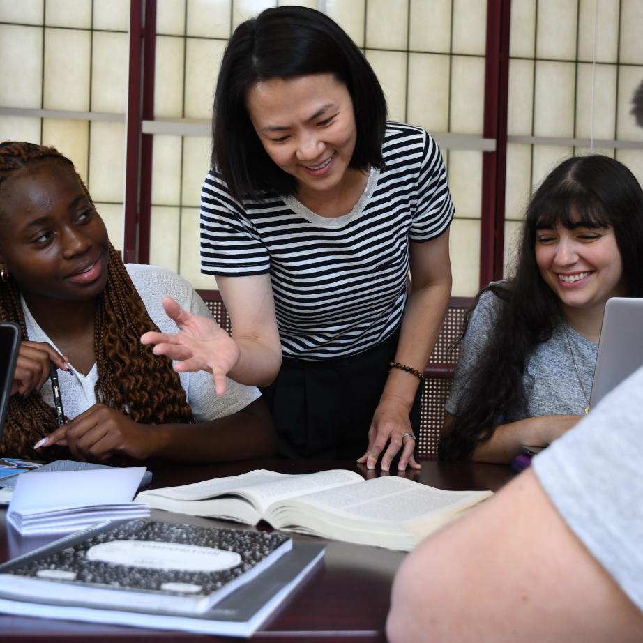 Faculty member assists a student.