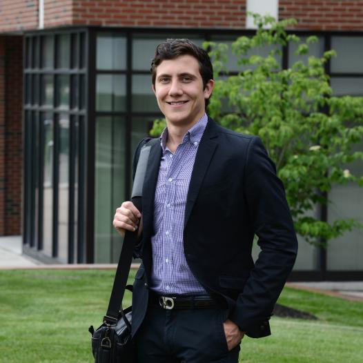 Marlon Fiacco standing in front of a building on campus