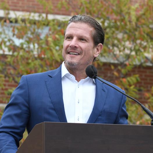 Rob Schimek speaking at an event.