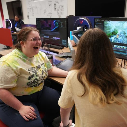 two game design students discussing 