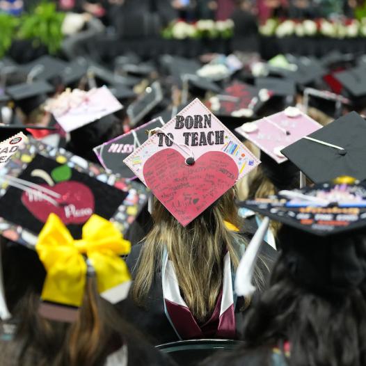 Students wear celebratory garb at Commencement ceremony