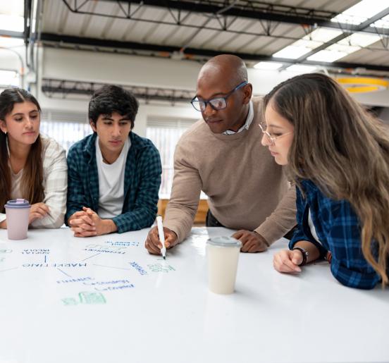 Business faculty leads students in a lesson