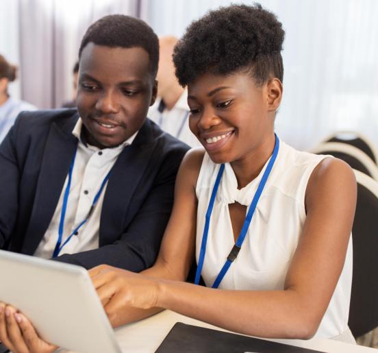 Two colleagues look at presentation