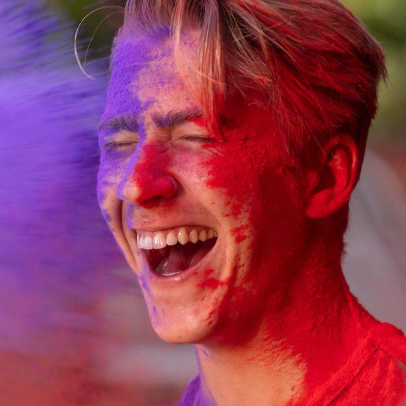 Student get's purple and red paint thrown at him.