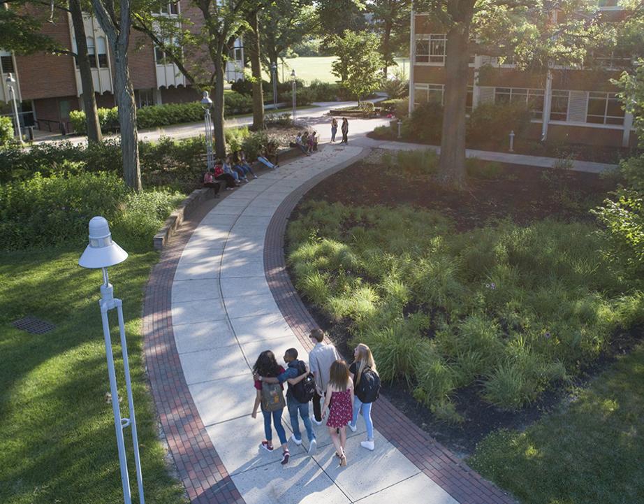 A group of students walking across campus