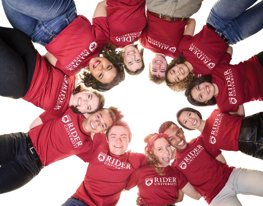 Student stand in a circle and smile for camera